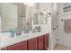 Bright bathroom with vanity, framed mirror, and updated fixtures at 8304 E Inca St, Mesa, AZ 85207