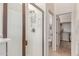 Bathroom features a glass enclosed shower, toilet and access to a walk-in closet at 8304 E Inca St, Mesa, AZ 85207