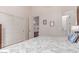 Bedroom with large bed, double door closet, and ensuite bathroom at 8304 E Inca St, Mesa, AZ 85207