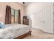 Bedroom with decorative curtains, carpeted floor, and double door closet at 8304 E Inca St, Mesa, AZ 85207