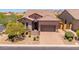 Charming single-Gathering home with desert landscaping, a paver driveway, and a tile roof at 8304 E Inca St, Mesa, AZ 85207
