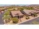 Charming single-Gathering home features a tile roof, desert landscaping, and an attached two-car garage at 8304 E Inca St, Mesa, AZ 85207