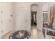 Bright foyer with tile flooring, neutral decor, and an arched entryway leading to the main living spaces at 8304 E Inca St, Mesa, AZ 85207