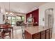 Open-concept living area with a large window, modern decor, and seamless flow into the kitchen at 8304 E Inca St, Mesa, AZ 85207