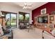 Cozy living room with a large window, comfortable seating, and stylish decor at 8304 E Inca St, Mesa, AZ 85207