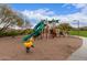 Community playground with slides, climbing structures, and spring riders at 8304 E Inca St, Mesa, AZ 85207