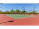Outdoor tennis court with new surfacing, trees and lights at 8304 E Inca St, Mesa, AZ 85207