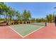 Outdoor tennis court featuring mature trees and an athletic court at 8304 E Inca St, Mesa, AZ 85207