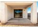View of a covered back patio with sliding glass doors, providing a seamless transition to indoor and outdoor living at 9249 E Sector Dr, Mesa, AZ 85212