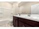 Bathroom features a double sink vanity and tub shower combination at 9249 E Sector Dr, Mesa, AZ 85212