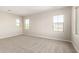 Bright bedroom with three windows and plush carpeting creates a cozy retreat at 9249 E Sector Dr, Mesa, AZ 85212