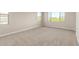 Carpeted bedroom with three large windows offers plenty of natural light at 9249 E Sector Dr, Mesa, AZ 85212