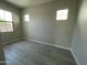 Inviting bedroom with wood-look floors, light-colored walls, and ample natural light, creating a serene and airy atmosphere at 9249 E Sector Dr, Mesa, AZ 85212