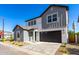 Charming two-story home featuring gray tones, a two-car garage and a welcoming front yard at 9249 E Sector Dr, Mesa, AZ 85212