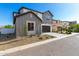 Charming two-story home featuring gray tones, a two-car garage and a welcoming front yard at 9249 E Sector Dr, Mesa, AZ 85212