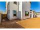 Rear exterior view highlighting the home's architecture with a covered patio and multiple windows enhancing natural light at 9249 E Sector Dr, Mesa, AZ 85212