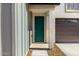 Close up of the front door and 2-car garage at 9249 E Sector Dr, Mesa, AZ 85212