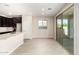 Bright kitchen features a center island, pantry, and sliding glass doors to backyard at 9249 E Sector Dr, Mesa, AZ 85212