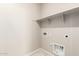 A well-equipped laundry room featuring modern appliances and ample space for efficient chore management at 9249 E Sector Dr, Mesa, AZ 85212