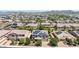 Overhead view of a suburban neighborhood with mountain views in the background at 9372 W Louise Dr, Peoria, AZ 85383