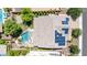Aerial view of a home with a pool, landscaping, a patio, and solar panels at 9372 W Louise Dr, Peoria, AZ 85383