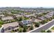 Aerial view of a neighborhood with single-Gathering homes and mountain views in the distance at 9372 W Louise Dr, Peoria, AZ 85383