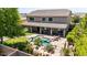 This backyard is an oasis with a custom pool featuring a slide, lush landscaping, and covered patio at 9372 W Louise Dr, Peoria, AZ 85383