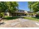 Expansive backyard with a pool, patio, lush green grass, and desert landscaping at 9372 W Louise Dr, Peoria, AZ 85383