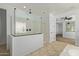 Modern bathroom featuring a glass-enclosed shower with dual shower heads and stylish tile flooring at 9372 W Louise Dr, Peoria, AZ 85383