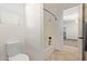 Bathroom with toilet and bathtub featuring shower fixture and bright lighting at 9372 W Louise Dr, Peoria, AZ 85383