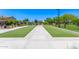 Well-maintained bocce ball court with pristine landscaping, offering a relaxing outdoor activity at 9372 W Louise Dr, Peoria, AZ 85383
