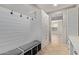 An entryway features a white coat rack with storage and tile flooring at 9372 W Louise Dr, Peoria, AZ 85383