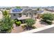 Beautiful two-story home enhanced with solar panels and landscaped front yard offers comfort and style at 9372 W Louise Dr, Peoria, AZ 85383