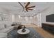 Spacious upstairs living room with plush seating and media center at 9372 W Louise Dr, Peoria, AZ 85383