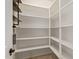 Walk-in pantry with ample shelving space for optimal organization and storage at 9372 W Louise Dr, Peoria, AZ 85383