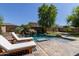 Backyard pool area features water feature, patio and lounge seating at 9372 W Louise Dr, Peoria, AZ 85383