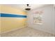 Cozy bedroom featuring a blue accent wall, hardwood floors, and natural light at 9714 N 55Th Dr, Glendale, AZ 85302