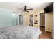 Spacious bedroom with ensuite bathroom, ceiling fan, and walk-in closet at 9714 N 55Th Dr, Glendale, AZ 85302