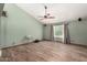 Open-concept home featuring updated flooring and neutral walls with a vaulted ceiling at 9714 N 55Th Dr, Glendale, AZ 85302