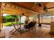 Inviting covered patio with ceiling fans and a comfortable seating area for relaxing at 9714 N 55Th Dr, Glendale, AZ 85302