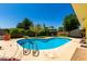 Backyard pool featuring a diving board, desert landscaping and a gazebo for outdoor entertaining at 9714 N 55Th Dr, Glendale, AZ 85302