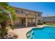 Back exterior view showcasing pool, covered patio, and second story windows at 986 W Citrus Way, Chandler, AZ 85248