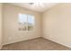 Bedroom with a window and neutral walls and carpeting is waiting for your inspiration at 986 W Citrus Way, Chandler, AZ 85248