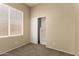 Neutral bedroom features include a large window, a closet, and wall to wall carpeting at 986 W Citrus Way, Chandler, AZ 85248