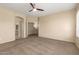 Bedroom features a ceiling fan, doorway to an arched entry to the bathroom and closet space at 986 W Citrus Way, Chandler, AZ 85248