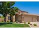 Inviting two-story home with a three-car garage and well-manicured lawn at 986 W Citrus Way, Chandler, AZ 85248