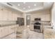 Updated kitchen with stainless steel appliances, granite countertops, and a convenient island at 986 W Citrus Way, Chandler, AZ 85248