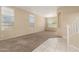 Bright living room featuring neutral paint, tile and carpet flooring, and ample natural light at 986 W Citrus Way, Chandler, AZ 85248