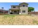 Large backyard with a covered patio and mature landscaping, perfect for entertaining at 997 E White Wing Dr, Casa Grande, AZ 85122