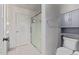 Bathroom featuring a glass-enclosed shower and built-in cabinet at 997 E White Wing Dr, Casa Grande, AZ 85122